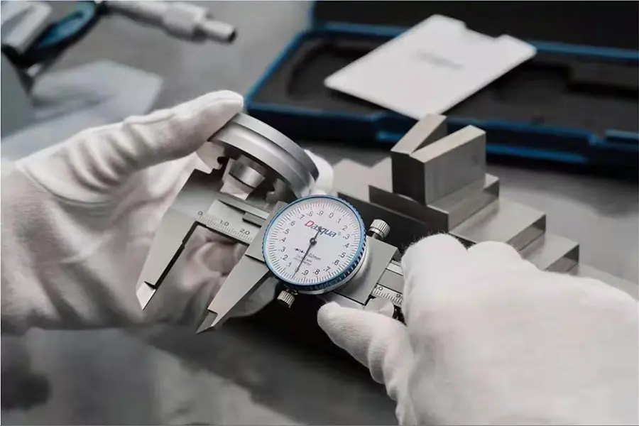 Engineers using DASQUA precision measuring tools for industrial dimensional inspection